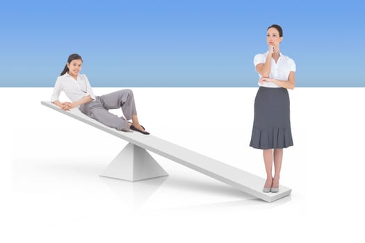 White scales weighing businesswomen against white and blue background