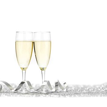 Two glasses of champagne with bow on silver background