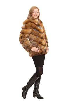 The blue-eyed blonde in a magnificent fur coat, it is isolated on a white background