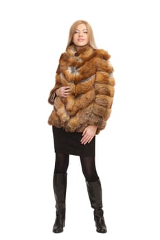 The blue-eyed blonde in a magnificent fur coat, it is isolated on a white background