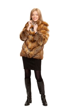 The blue-eyed blonde in a magnificent fur coat, it is isolated on a white background