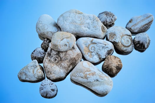 Stones with the textured helix on the blue background