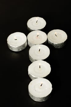 cross made of candles