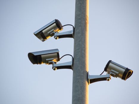 Security surveillance camera on a metal pole Big Brother