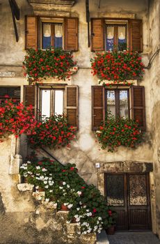 typical italian windows on a building facade in Pescocostanzo, Italy