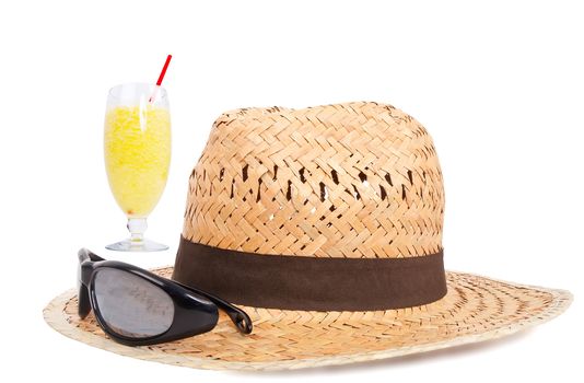 hat, sun glasses and juice on white background