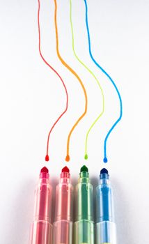 colored markers, red, orange, green, blue, drawing lines