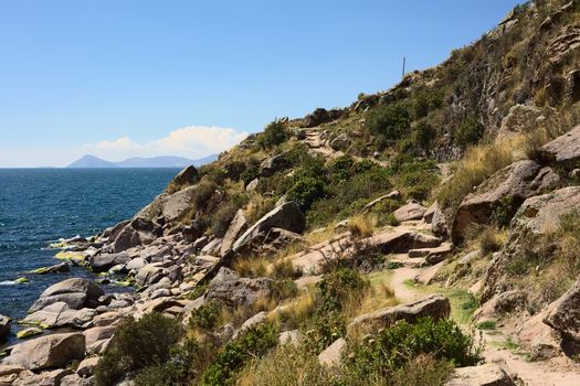 Rocky coastline of Lake Titicaca close to the small tourist town of Copacabana in Bolivia