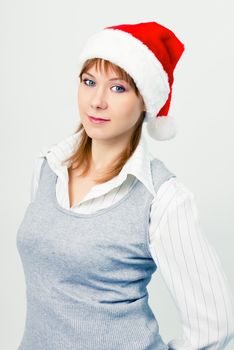 Attractive girl in santa hat. Portrait. studio