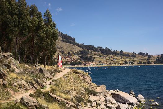 The beacon of the small tourist town of Copacabana on the rocky shore of Lake Titicaca in Bolivia 