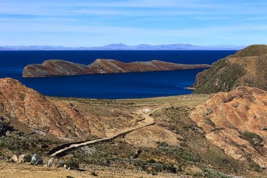 Rocky path leading to the archeological site of the Ceremonial Table (Mesa Ceremonial) and the Rock of the Puma (Titicaca) on Isla del Sol (Island of the Sun) in Lake Titicaca, which is a popular travel destination in Bolivia