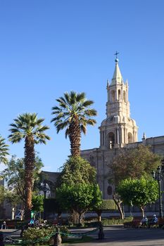 AREQUIPA, PERU - OCTOBER 8, 2014: Plaza de Armas (main square) and the Basilica Cathedral in the historical city center early in the morning on October 8, 2014 in Arequipa, Peru. Arequipa is an UNESCO World Cultural Heritage Site. 
