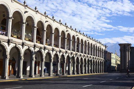 AREQUIPA, PERU - OCTOBER 8, 2014: The archway of Portal de San Agustin along the Plaza de Armas (main square) early in the morning on October 8, 2014 in Arequipa, Peru. Arequipa is an UNESCO World Cultural Heritage Site. 