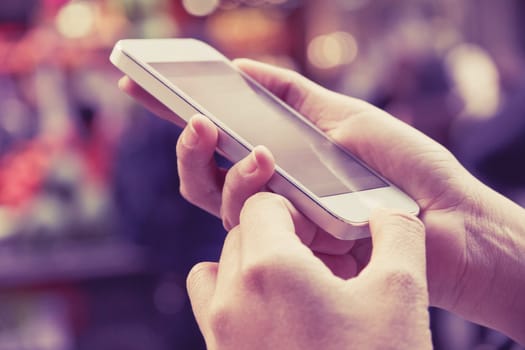 Teenage girl text messaging on her phone