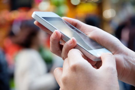 Teenage girl text messaging on her phone