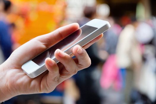 Teenage girl text messaging on her phone