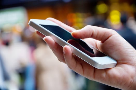 Teenage girl text messaging on her phone