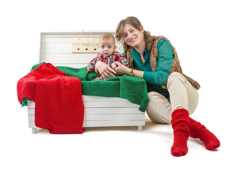 Baby boy in old box with his mother on white background