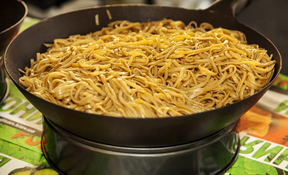 Asian traditional noodles in wok