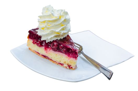 Cherry cake with cream on a white plate against white background 