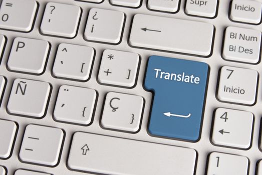 Spanish keyboard with language translate concept icon over blue background button.  Image with clipping path for easy change the key color and editing.