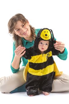 baby boy dressed up like bee with his mother on white background