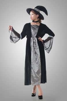 Asian witch hold something, full length portrait isolated.