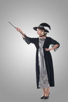 Asian witch hold something, full length portrait isolated.