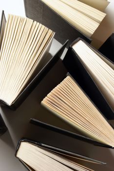 A variety of books from an overhead viewpoint.