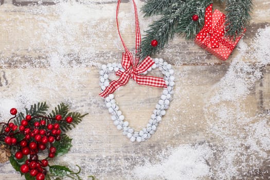 Christmas heart on a wooden background. Copy space for your text.