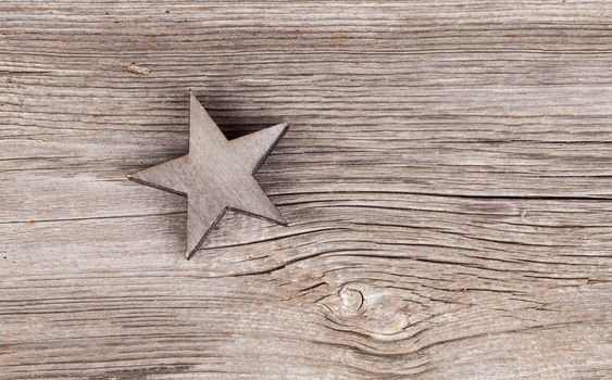 Old xmas star on wooden vintage background