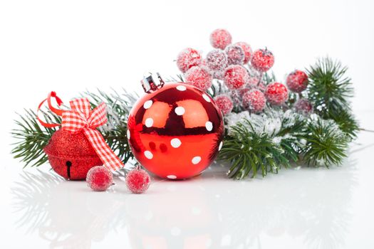 Christmas balls and fir branches with decorations isolated over white