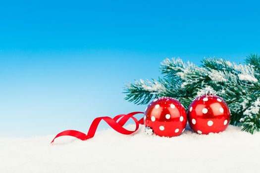 Christmas decoration over snow, blue background