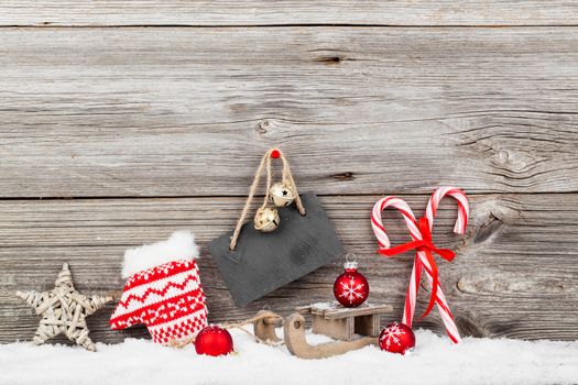 Christmas decoration with xmas canes, over wooden background