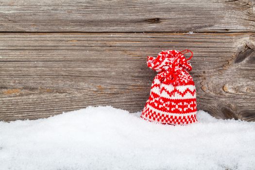 Christmas bag, gift over wooden background