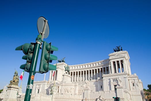 Photo shows Rome cityscape with houses and roofs.