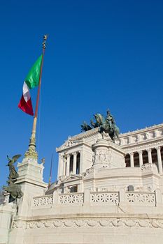 Photo shows Rome cityscape with houses and roofs.