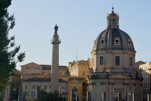 Photo shows Rome cityscape with houses and roofs.