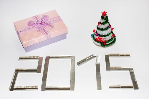 Happy new 2015 year with staples on the white background.