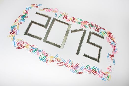 Happy new 2015 year with staples on the white background.