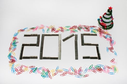 Happy new 2015 year with staples on the white background.