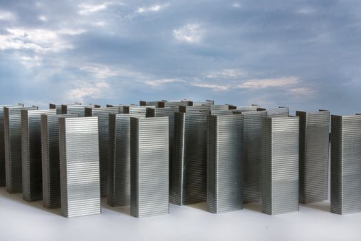 Staples as city buildings with blue sky. Abstract image for commercial and business ad.