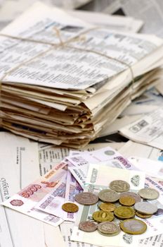 old newspapers,russian banknotes and coin