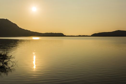 Yellow sunset on the lake