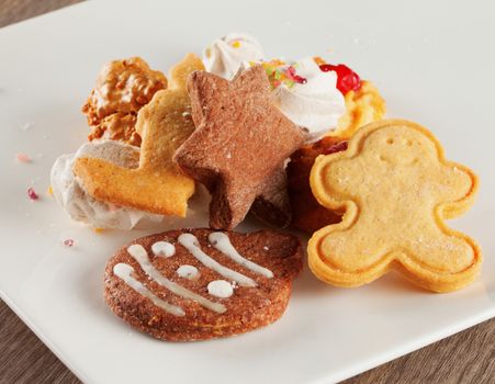 Assorted Christmas biscuits over a white plate