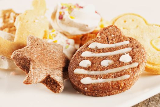 Assorted Christmas biscuits over a white plate