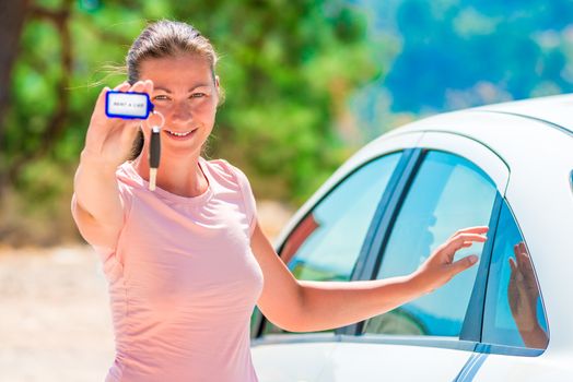 beautiful girl shows rental car Keychain