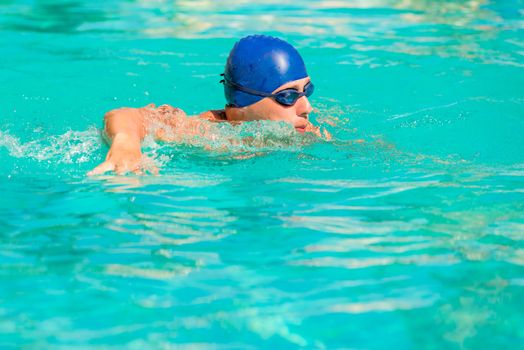 athlete exercising in the pool outdoors