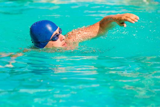 a young male engaged in sports swimming