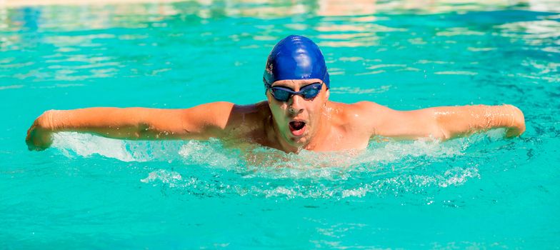 portrait of a young swimmer going in for sports